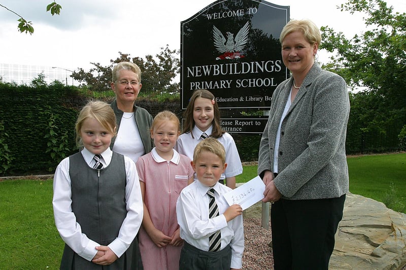 Newbuildings Primary School pupils (from left), Rebecca McClelland, Hannah Caldwell, Jody Spence and Cameron Hancock, handing over a cheque for £2,134.40, to Ann Wilson, Appeals Officer with Action MS, NI. Included is teacher Joan Robinson.