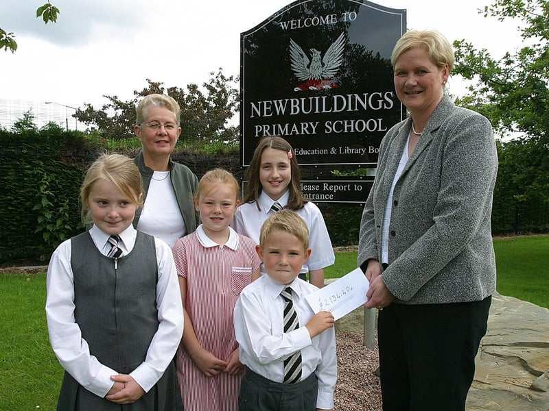 Newbuildings Primary School pupils (from left), Rebecca McClelland, Hannah Caldwell, Jody Spence and Cameron Hancock, handing over a cheque for £2,134.40, to Ann Wilson, Appeals Officer with Action MS, NI. Included is teacher Joan Robinson.