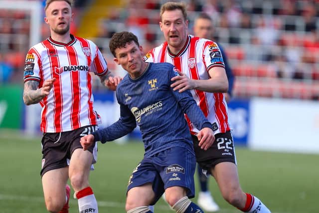 Kevin Holt and Carl Winchester apply the pressure in the big win over Shelbourne at Brandywell.