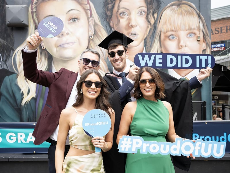 Mechanical Engineering and Manufacturing graduate Céin McColgan from Muff (County Donegal) celebrates with dad Damien McColgan, mum Suemantha McColgan, and girlfriend Iona Wade as he graduates from Ulster University in Derry on Monday July 8.  (Photo: Nigel McDowell / Ulster University)