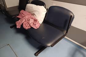 The corridor seating where the woman said they were told her 80-year-old father could sleep.