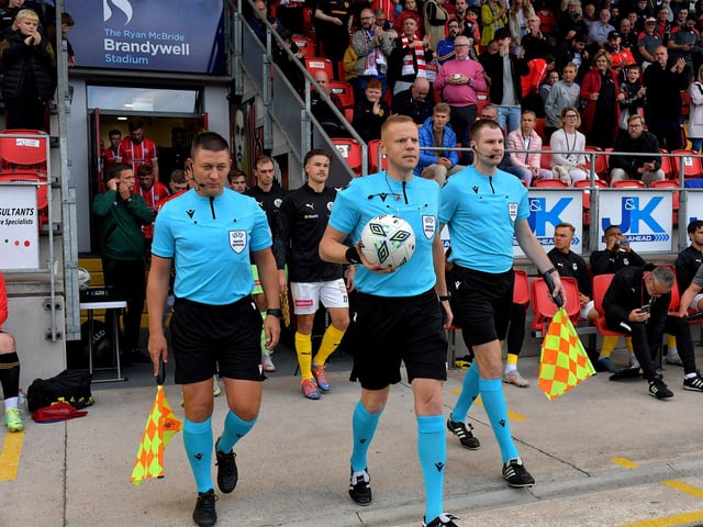UEFA referee Robertas Valikonis , from Lithuania, leads out the Derry City and KuPs FC teams at the Brandywell Stadium on Thursday evening. Photo: George Sweeney.DER2330GS -