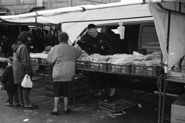 A sale is made at the Foyle Street market.