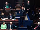 TOPSHOT - US President Joe Biden (C) reacts as he arrives to deliver a speech at the Dail Eireann, the lower house of the Irish Parliament, at Leinster House in Dublin, on April 13, 2023, during his four day trip to Northern Ireland and Ireland. (Photo by Jim WATSON / AFP) (Photo by JIM WATSON/AFP via Getty Images)