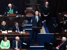 TOPSHOT - US President Joe Biden (C) reacts as he arrives to deliver a speech at the Dail Eireann, the lower house of the Irish Parliament, at Leinster House in Dublin, on April 13, 2023, during his four day trip to Northern Ireland and Ireland. (Photo by Jim WATSON / AFP) (Photo by JIM WATSON/AFP via Getty Images)