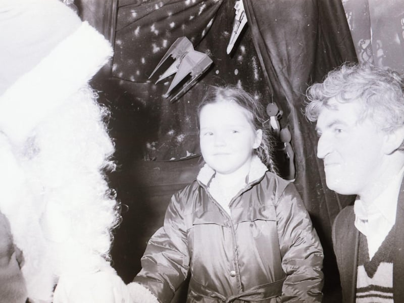 Children meeting Santa Claus at Wellworths shop in Waterloo Place.