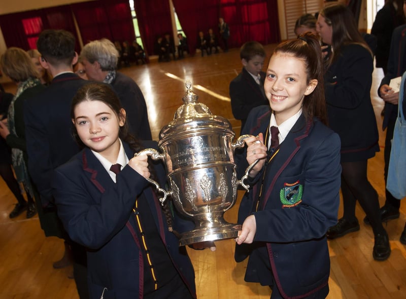 Two of the students take time to get a picture with the FAI Cup.