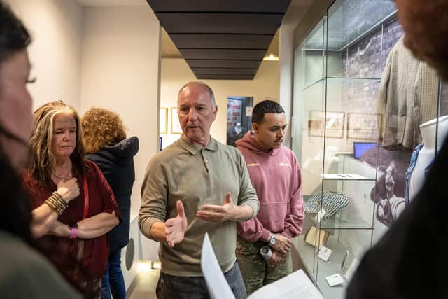 Bloody Sunday Trust Chair Tony Doherty leading a delegation of indigenous leaders and activists on a tour of the Museum of Free Derry.