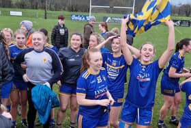 Enya Doherty and Niamh Friel lead the Steelstown celebrations in Carrickmore on Saturday.