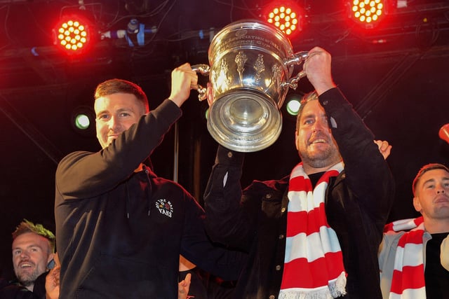 Derry City captain Patrick McEleney and manager Ruaidhrí Higgins with the FAI Cup in Guildhall Square last night during the homecoming celebrations. Photo: George Sweeney.  DER2244GS – 