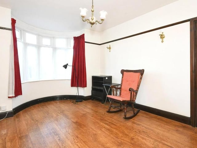The reception room, or sitting room, is the one that looks out on to the front of the house from its bay windows.