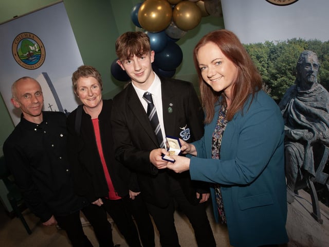Vincent Logue-O’Callaghan, winner of Subject Prize for Art and Design GCSE being presented with his award by Mrs McCay, Acting head of Art and Design. On left are Vincent's parents.