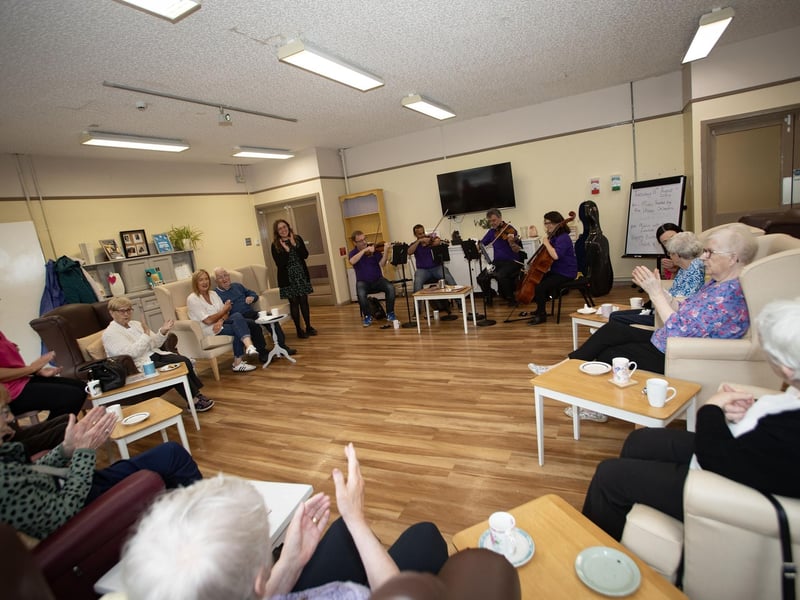 Residents and staff at the Creggan Day Centre applauding members of the Ulster Orchestra who performed at the centre on Tuesday morning last as part of Féile 24. (Photos: Jim McCafferty Photography)