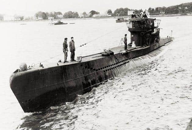 One of the u-boats surfacing on the River Foyle during the surrender.