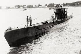 One of the u-boats surfacing on the River Foyle during the surrender.