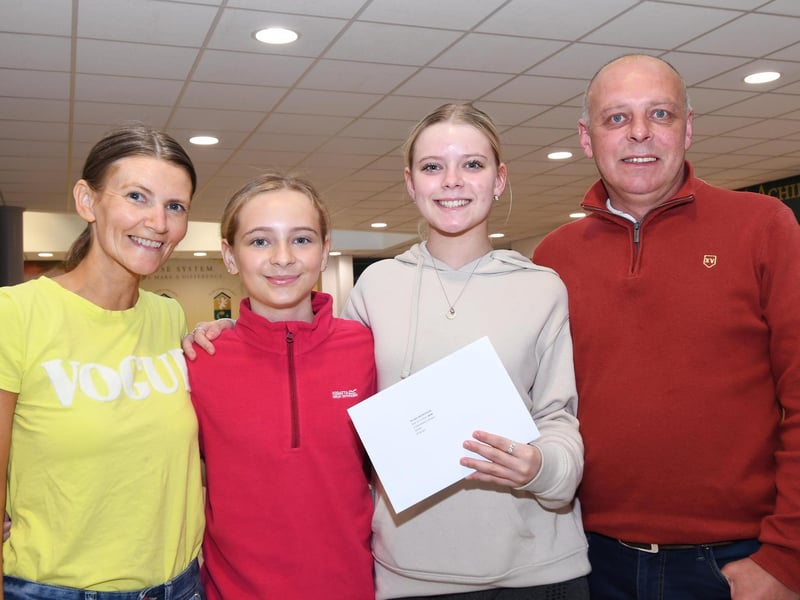 Brooke McCrudden pictured with proud family members, mum Erin, sister Summer Rose and dad William, when she collected her AS Level results at St. Cecilia's College.