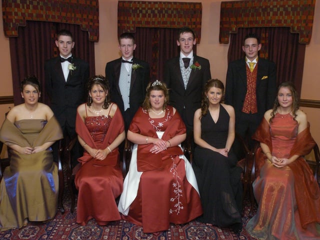 Seated, from left, Rosemarie Porter, Kathy McLaughlin, Marie Devlin, Noeleen O'Donnell, and Andrea McNutt. Standing, from left, Frank O'Donnell, Declan Walsh, Domhnall McLaughlin, and Donny Bell. (1801PG15) : Scoil Mhuire Formal  in January 2005.