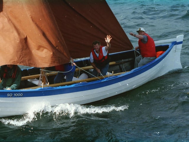 A wave to the onlookers at the Blessing of the Fleet ceremony.