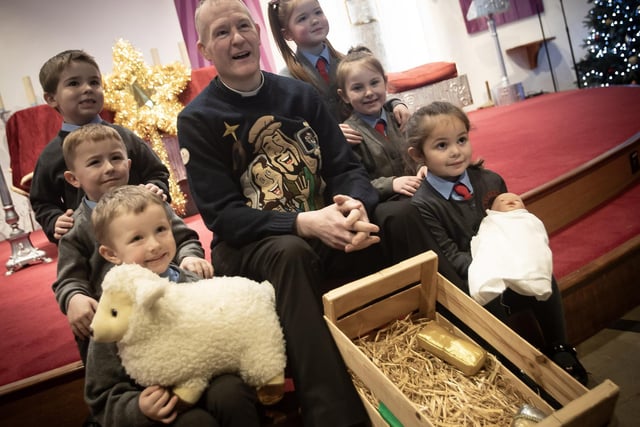 A number of the Primary 1 pupils from St. Brigid's PS pictured with Fr. Sean during the Christmas Nativity.