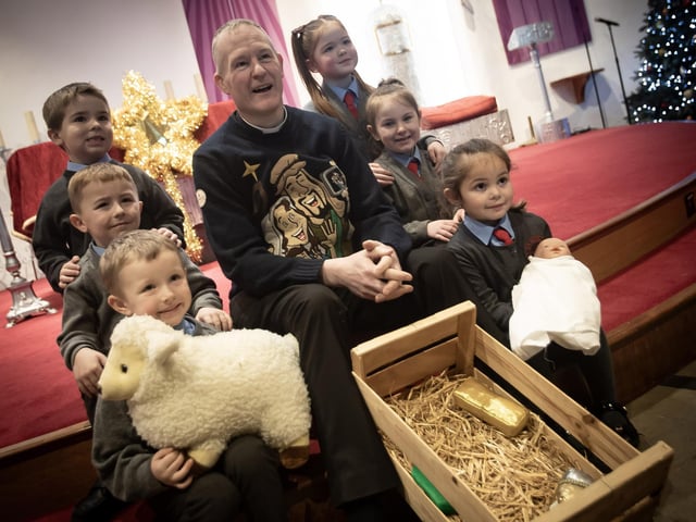 A number of the Primary 1 pupils from St. Brigid's PS pictured with Fr. Sean during the Christmas Nativity.