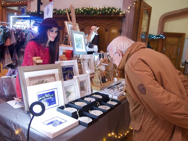 Leona Devine with her art on display.