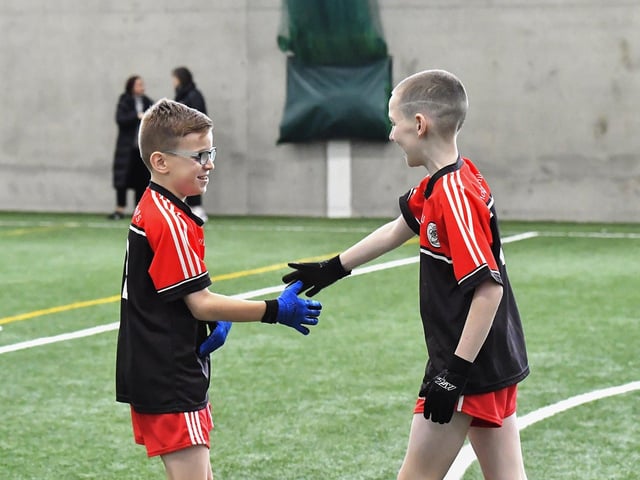 Friends take part in the Cumann na mBunscoil skills test at Sean Dolans GAC on Friday. Photo: George Sweeney