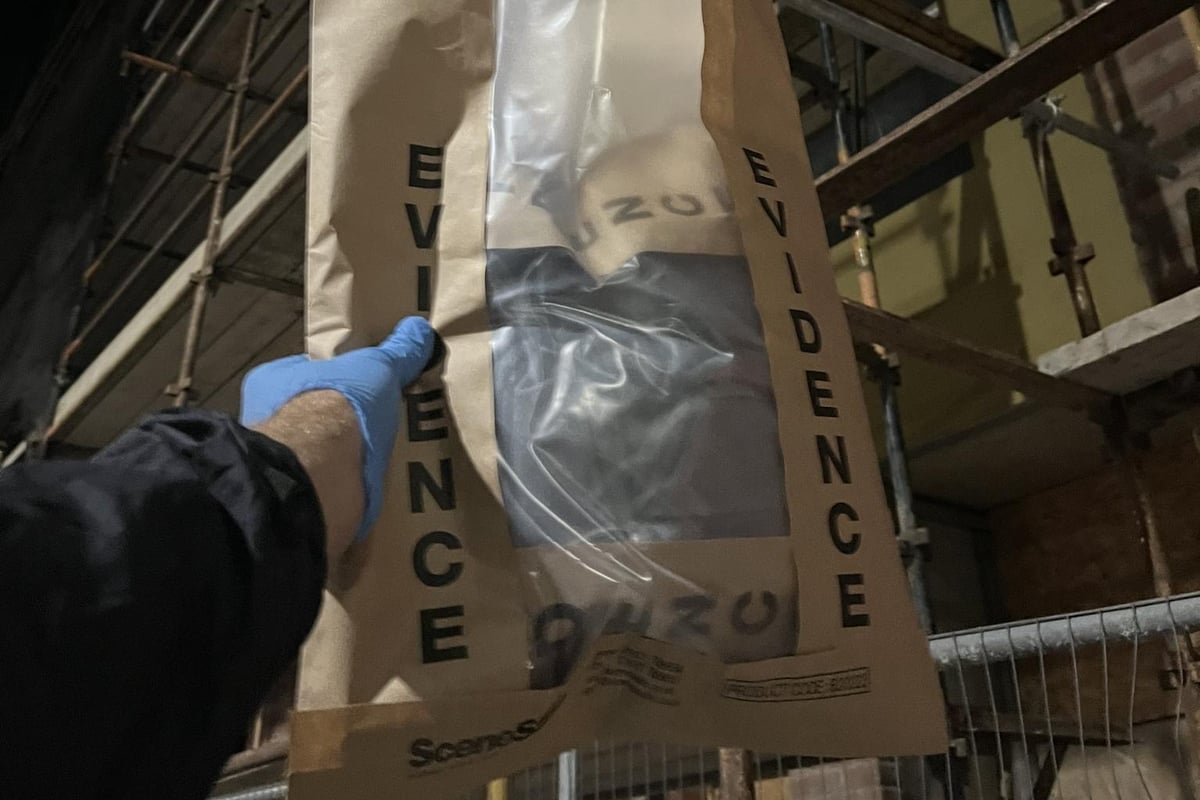 Specialist Police Officers Climb Scaffolding to Remove Potential Ev...