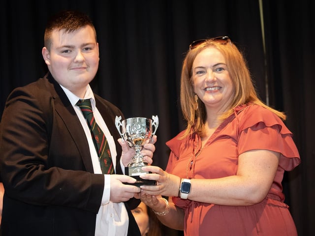 Ms. Carla Hagan, Head of Year presenting the award for GCSE Business Studies to Jay Curran on Thursday last.