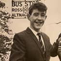 A 15 year old Sean Davis waiting on the bus to take him to Belfast Airport to board the plane to Manchester.