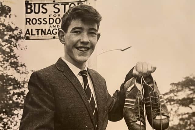 A 15 year old Sean Davis waiting on the bus to take him to Belfast Airport to board the plane to Manchester.