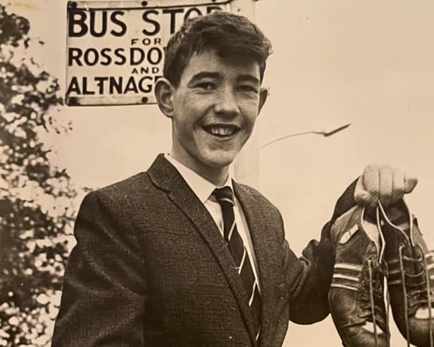 A 15 year old Sean Davis waiting on the bus to take him to Belfast Airport to board the plane to Manchester.