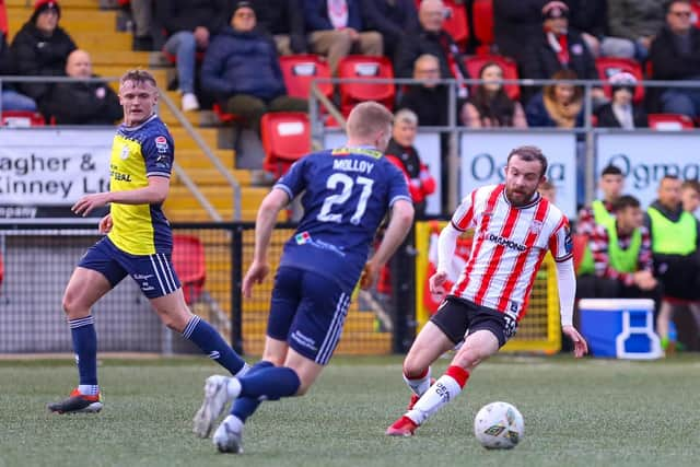 Paul McMullan turns away from Gavin Molloy during the 1-1 draw with Shels.