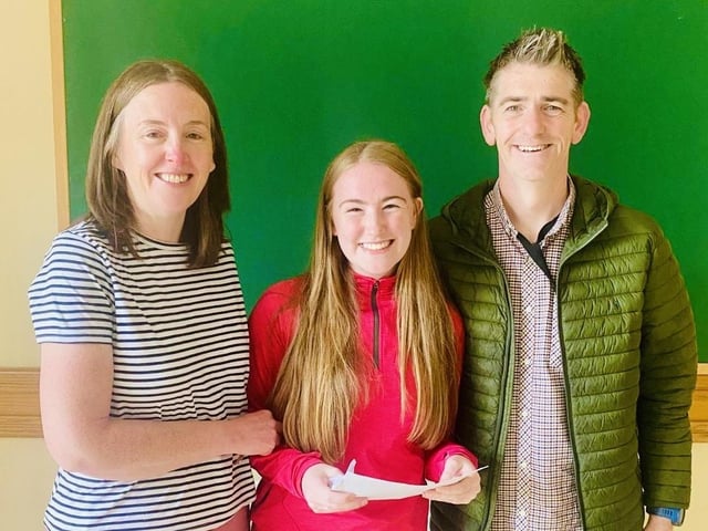 Hannah Mullan pictured with her parents as she receives her outstanding A Level results in Thornhill College.
