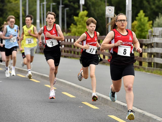 City of Derry Spartans Paul Devine (2), Jacob Furey (17) and Sarah Kelly (8) compete in the Muff Feile 5K on Saturday morning. Photo: George Sweeney