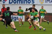 Cargin players converge on Glen’s Cathal Mulholland. Photo: George Sweeney