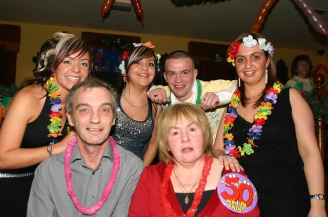 Ann Lydsay with her family L/R Husband Billy, Birthday girl Ann, back Emma, Ciaria,Steven and Nicola 1203/dd : Parties in December 2005.