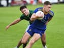 Steelstown's Ryan McCloskey powers past Newbridge player Jude Diamond during an earlier group game at Pairc Brid. (Photo: Keith Moore)