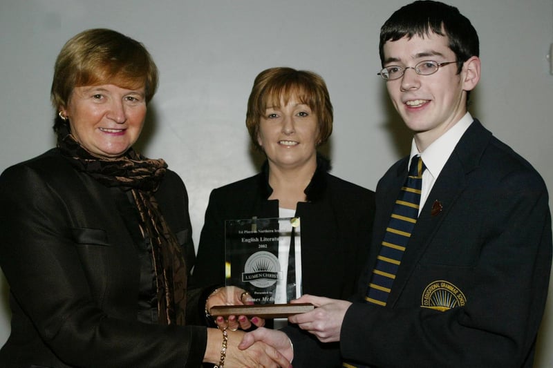 James McDaid who achieved 1st place in NI in English Literature in his recent GCSE exams picturee here receiving an award from Marian Machett, Chief Inspector DENI.  Also in photo is Mrs Catriona O'Donnell.  (1001JB28)