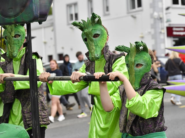 Muff Feile opening parade makes its way through the village on Friday evening. Photo: George Sweeney