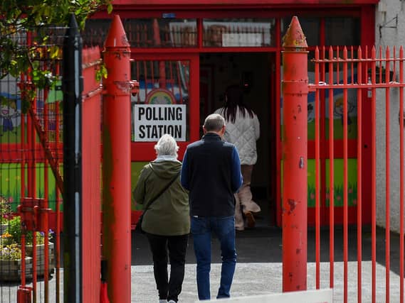 People arrive at the Holy Child Primary School to vote in the 2024 Westminster general election. Photo: George Sweeney