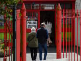 People arrive at the Holy Child Primary School to vote in the 2024 Westminster general election. Photo: George Sweeney