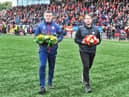 Derry City manager Ruaidhri Higgins and Treaty United boss Tommy Barrett lay a wreath in memory of the 10 people who lost their lives in Creeslough.