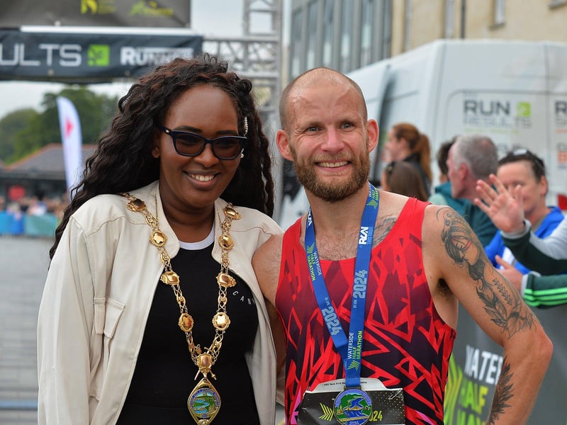 2024 Waterside Half Marathon winner Kyle Doherty, City of Derry Spartans, pictured with Mayor Lilian Seenoi Barr. Photo: George Sweeney