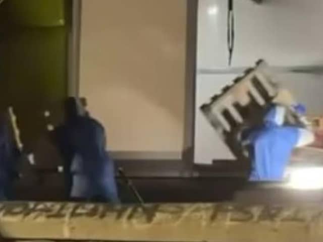 Pallets being removed from the Lecky Road area of Derry in the early hours of this morning. | Iconic Media