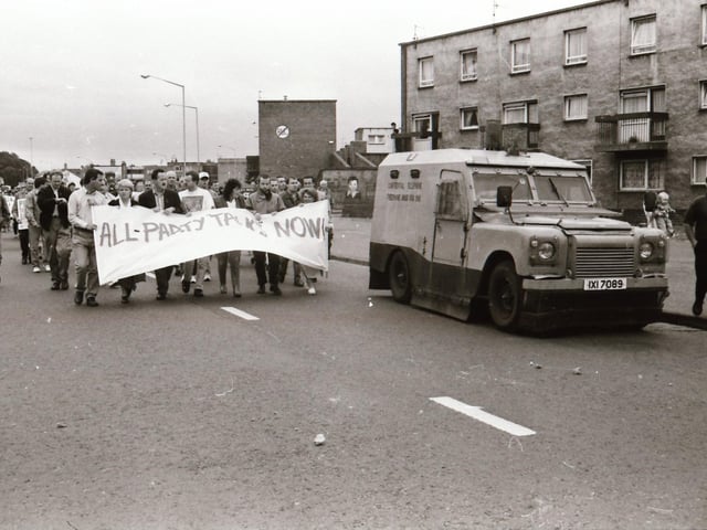 Sinn Féin's Martin McGuinness, Mary Nelis and other party members leading protests calling for all party peace talks.