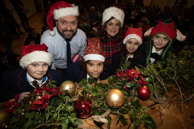Ready for Thursday's Joint Carol Service are Braxon Derosabrierley, Kai Kotey, Sonia Big, Carrie Blair along with Mr. Bolton and Ms. Strawbridge. (Photos: Jim McCafferty Photography)