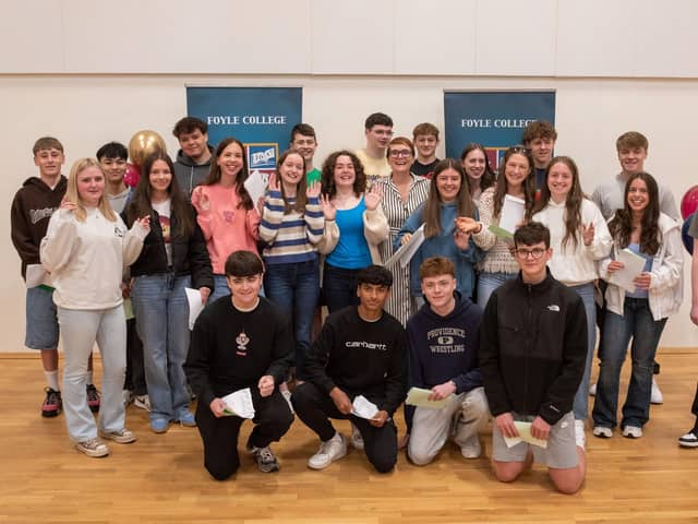 Foyle College pupils who are celebrating after receiving their GCSE results pictured with Principal Deirdre Mclaughlin on Thursday. Picture Martin McKeown