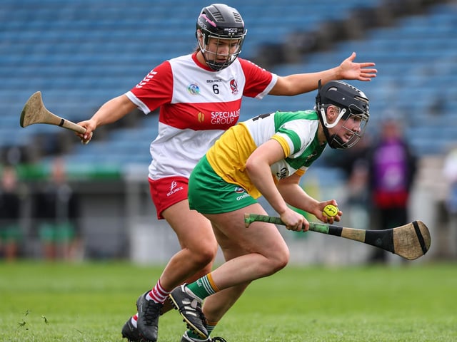 Derry's Niamh Quinn with Faye Mulrooney of Offaly during the Very Camogie League Division 2A Final at FBD Insurance Semple Stadium in Thurles. (Photo: INPHO/Ben Brady)