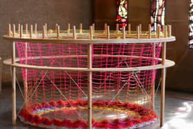 The Peacemakers exhibition gives attendees the opportunity to participate in the making of a unique piece of art with a large-scale French knitting loom