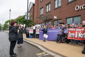 Emma Walker-Farren addressing the rally at the Department for Communities’ offices in Derry. (Credit: Neil Harrison)
